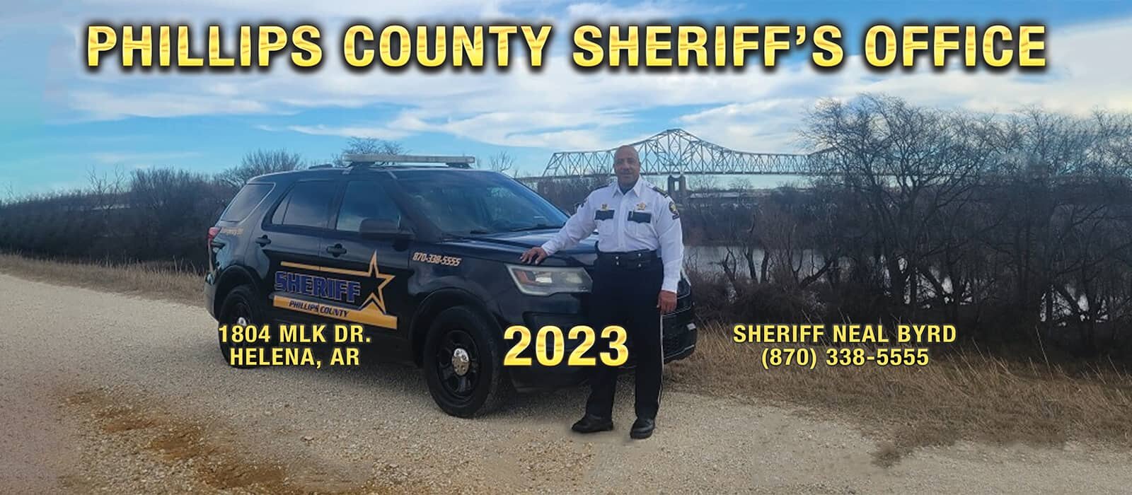 Sheriff Neal Byrd standing in front of Sheriff's Office Vehicle